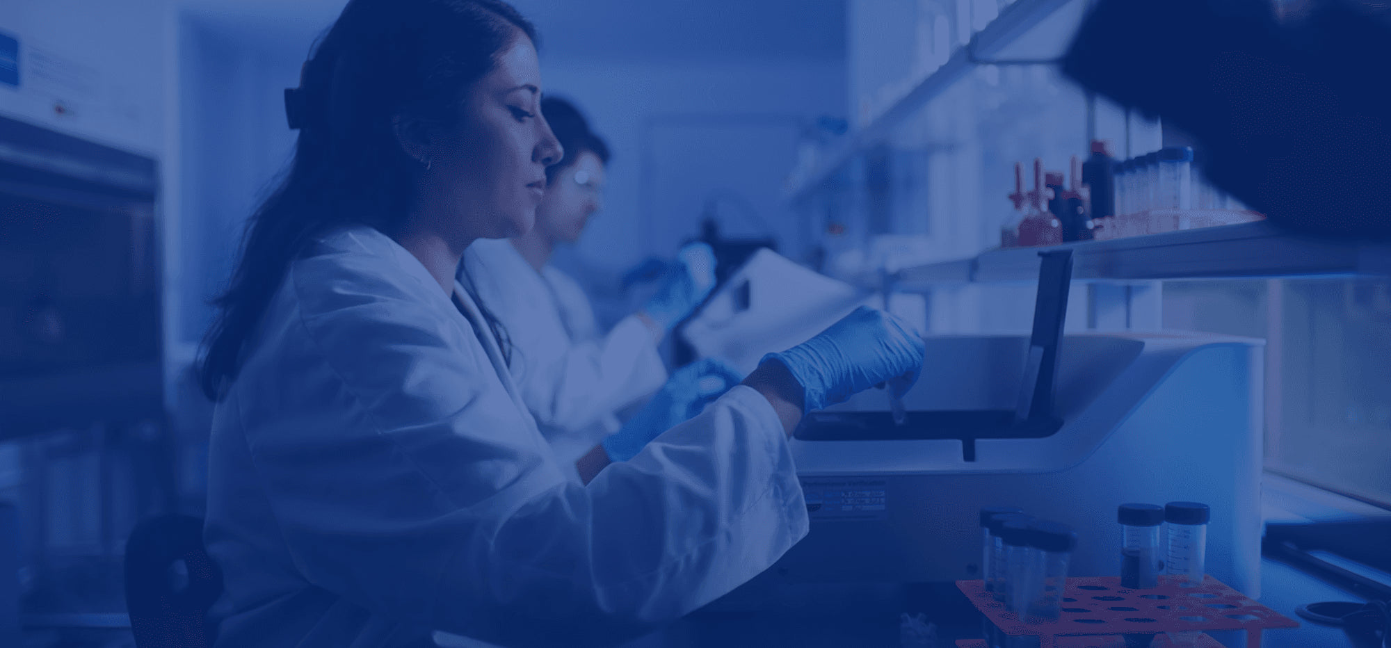 A female Nu Allumé scientist working on ingredients within the lab