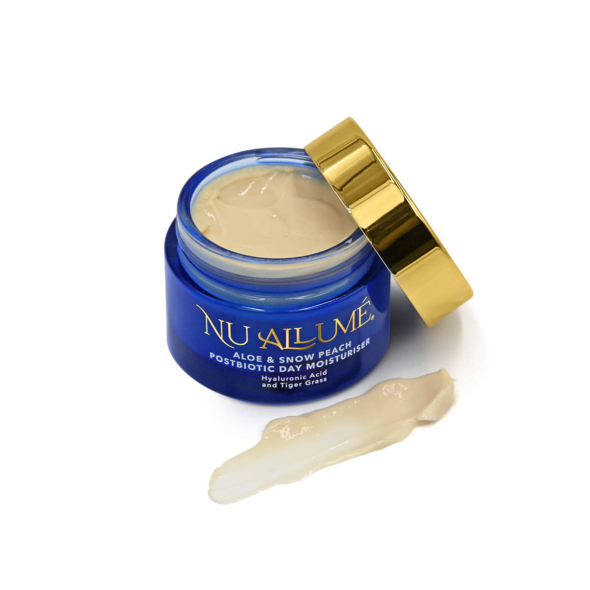 Open jar of Nu Allume Aloe and Snow Peach Postbiotic moisturiser with the gold lid and a smear of the moisturiser beside it to demonstrate texture.