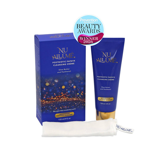 NU AILUME Postbiotic Papaya Cleansing Crème shown with its blue box, matching squeeze tube, and a folded white face cloth on a white background, with a Prevention Beauty Awards Winner 2026 badge above.
