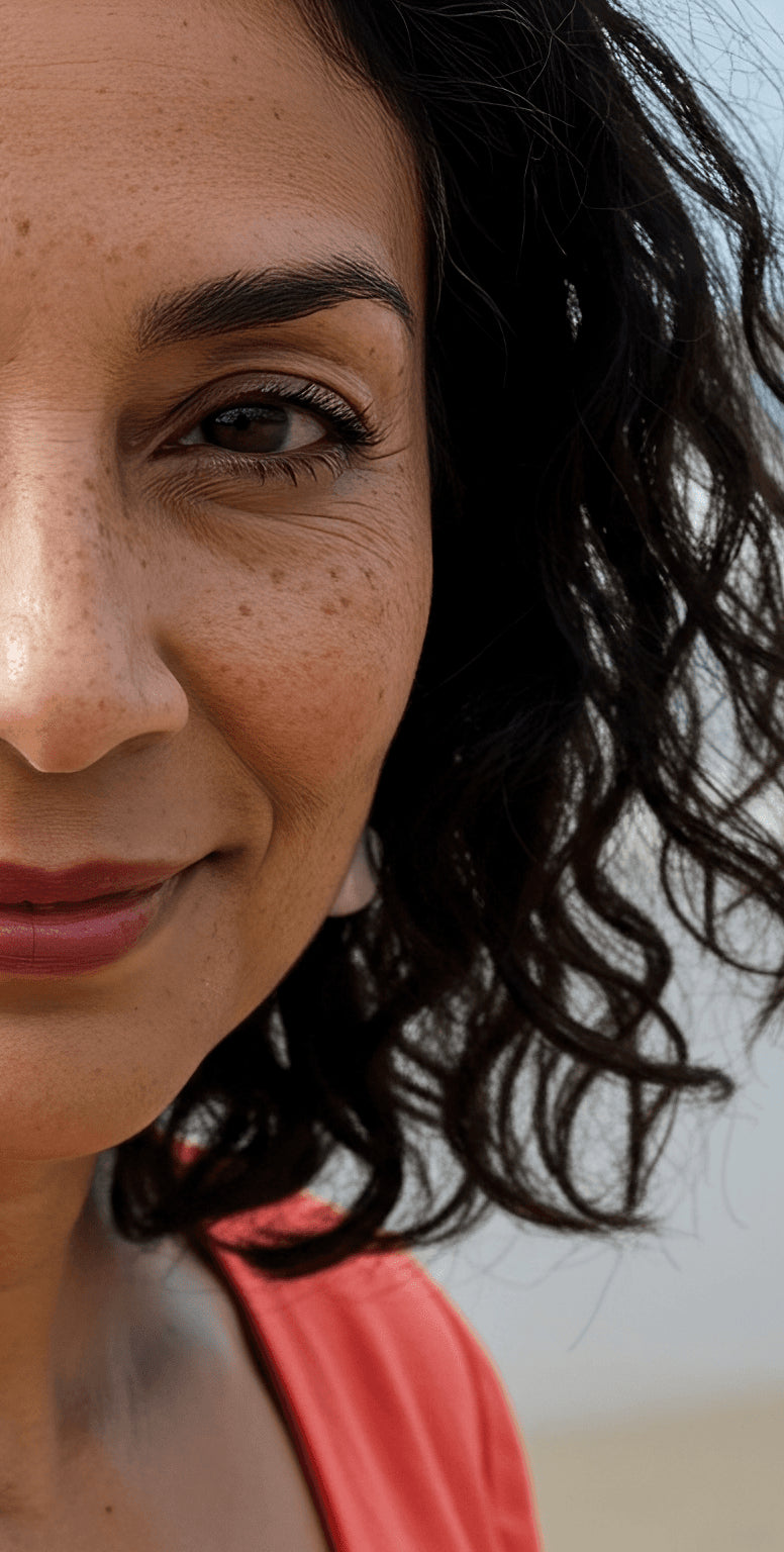 Middle aged woman looking into the camera with a slight smile